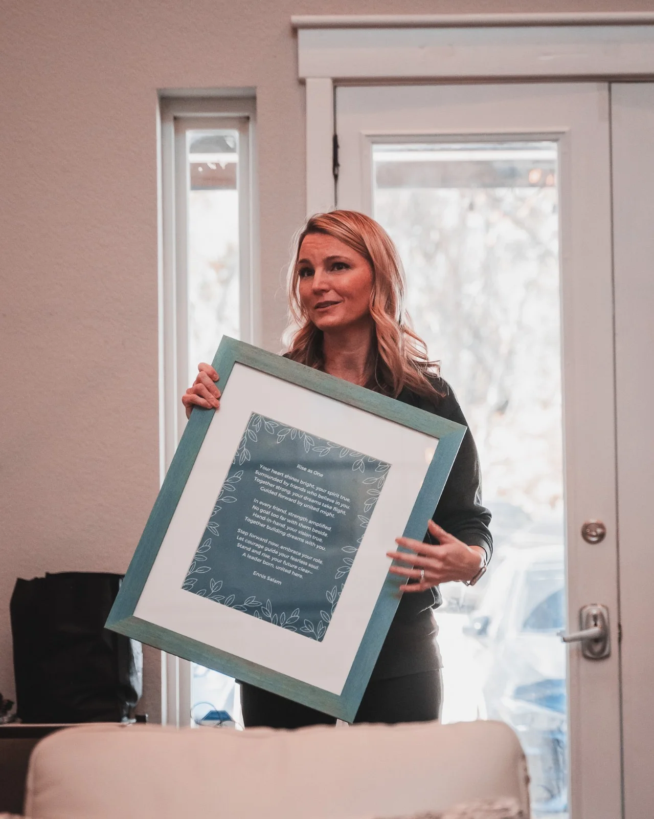 Framed commissioned poem being presented at Foster Village North